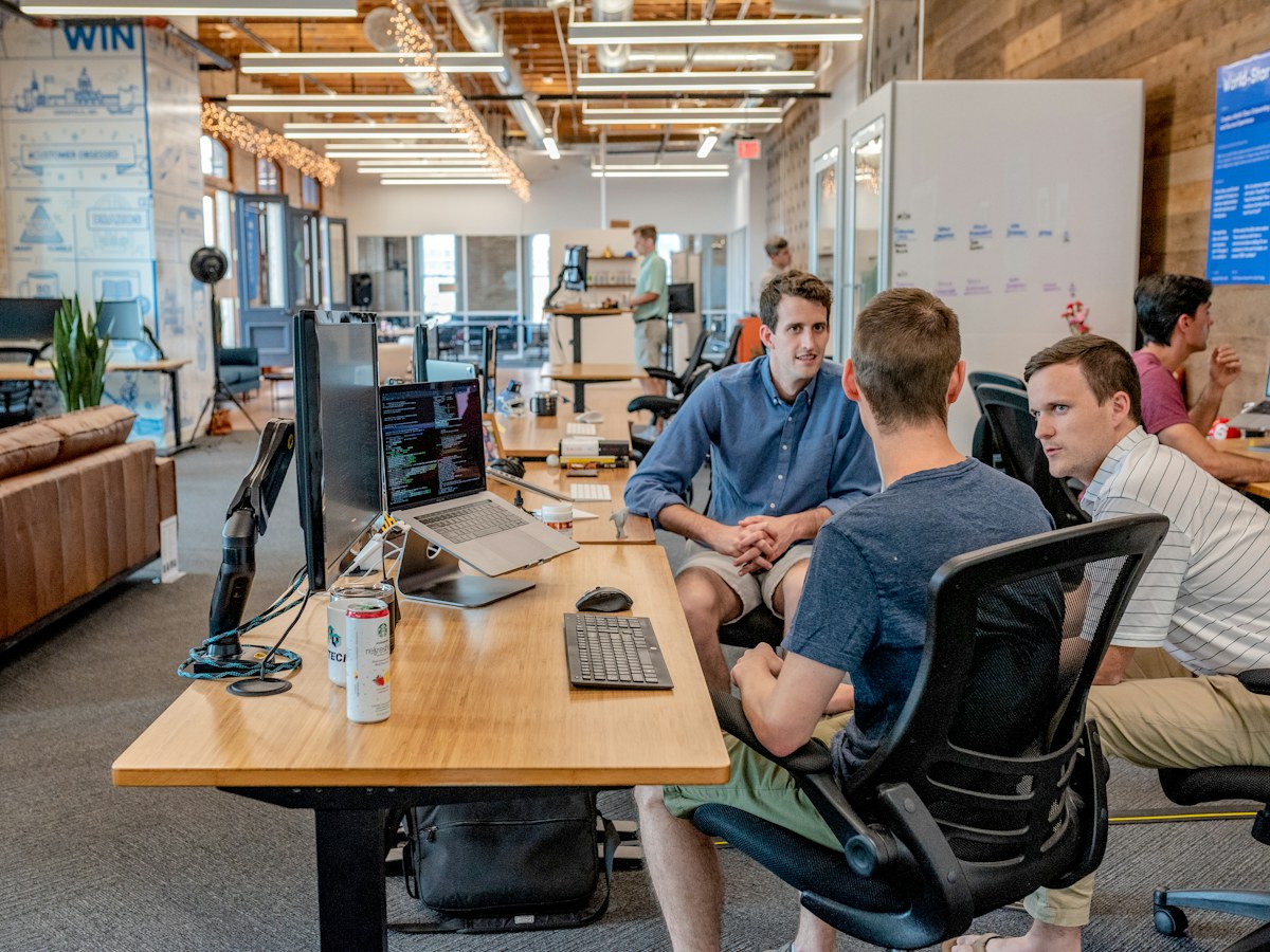 Professionals collaborating around a table during a business workshop